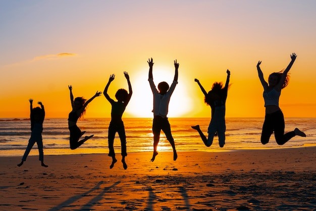 silhouettes-of-people-jumping-at-sunset_52683-122467